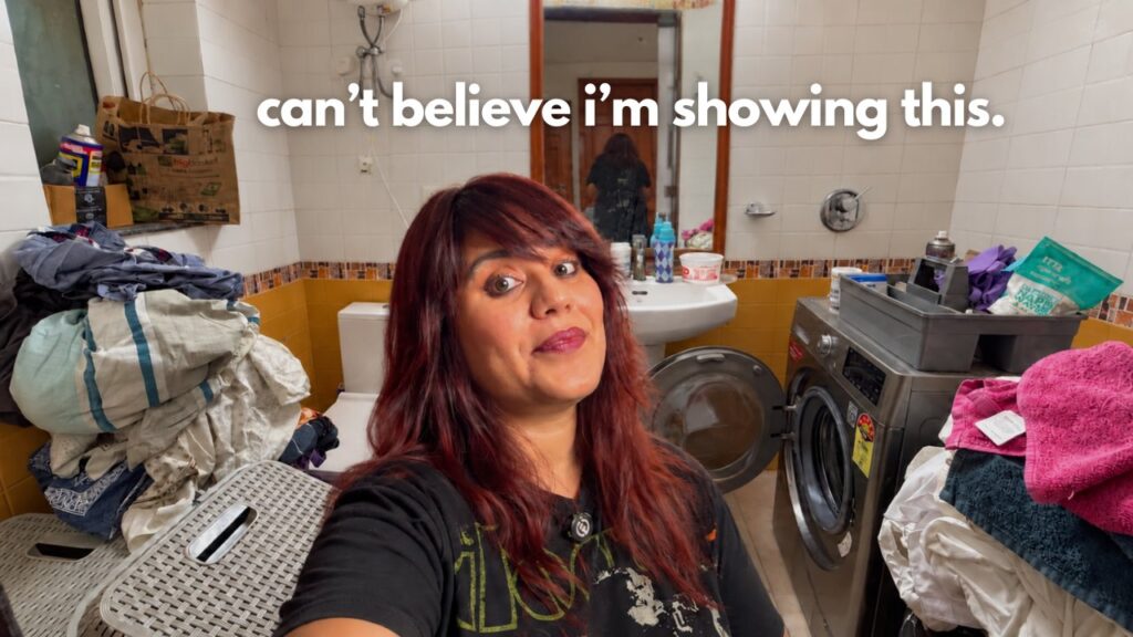 Aastha in her tiny laundry room before decluttering and reorganizing the overflowing baskets