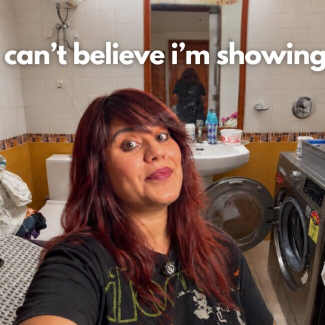 Aastha in her tiny laundry room before decluttering and reorganizing the overflowing baskets